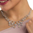 Salmon zircon necklace dazzles with its warm, unique glow for a stylish statement."
