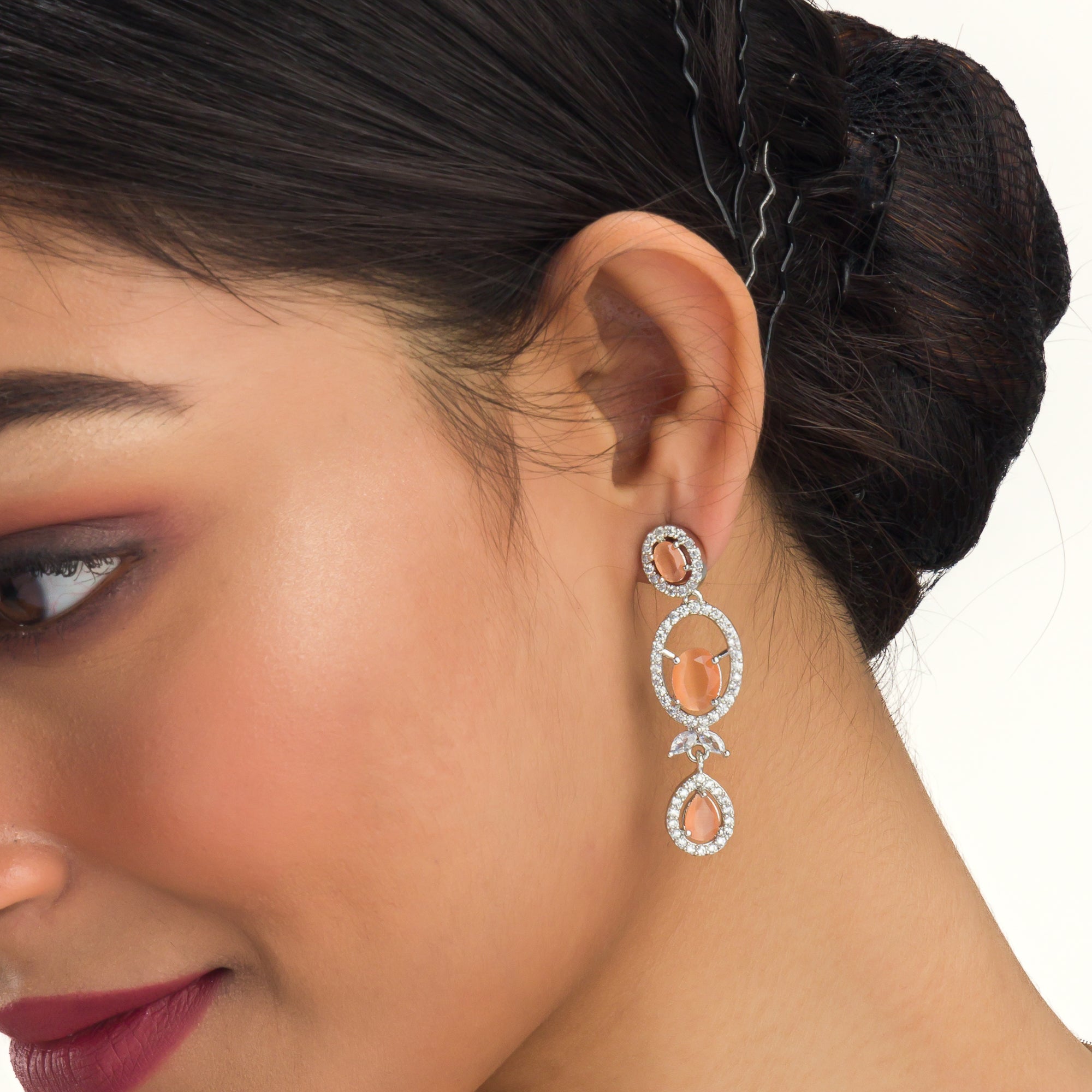 Salmon zircon necklace dazzles with its warm, unique glow for a stylish statement."
