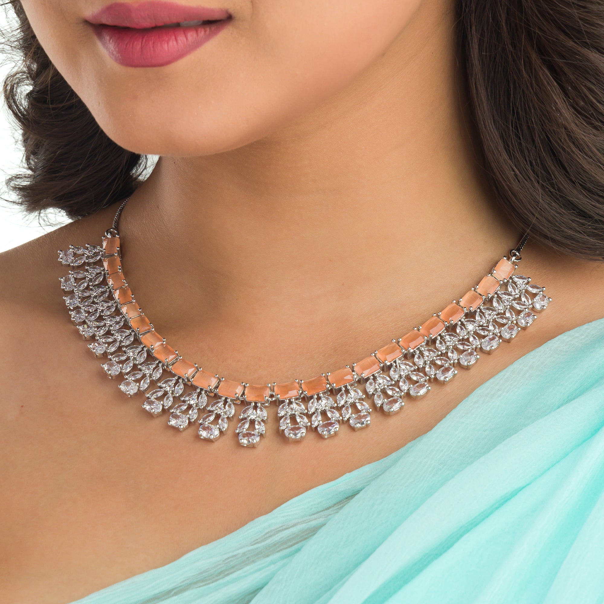 "Radiant orange zircon necklace delivers a bold, vibrant statement."
