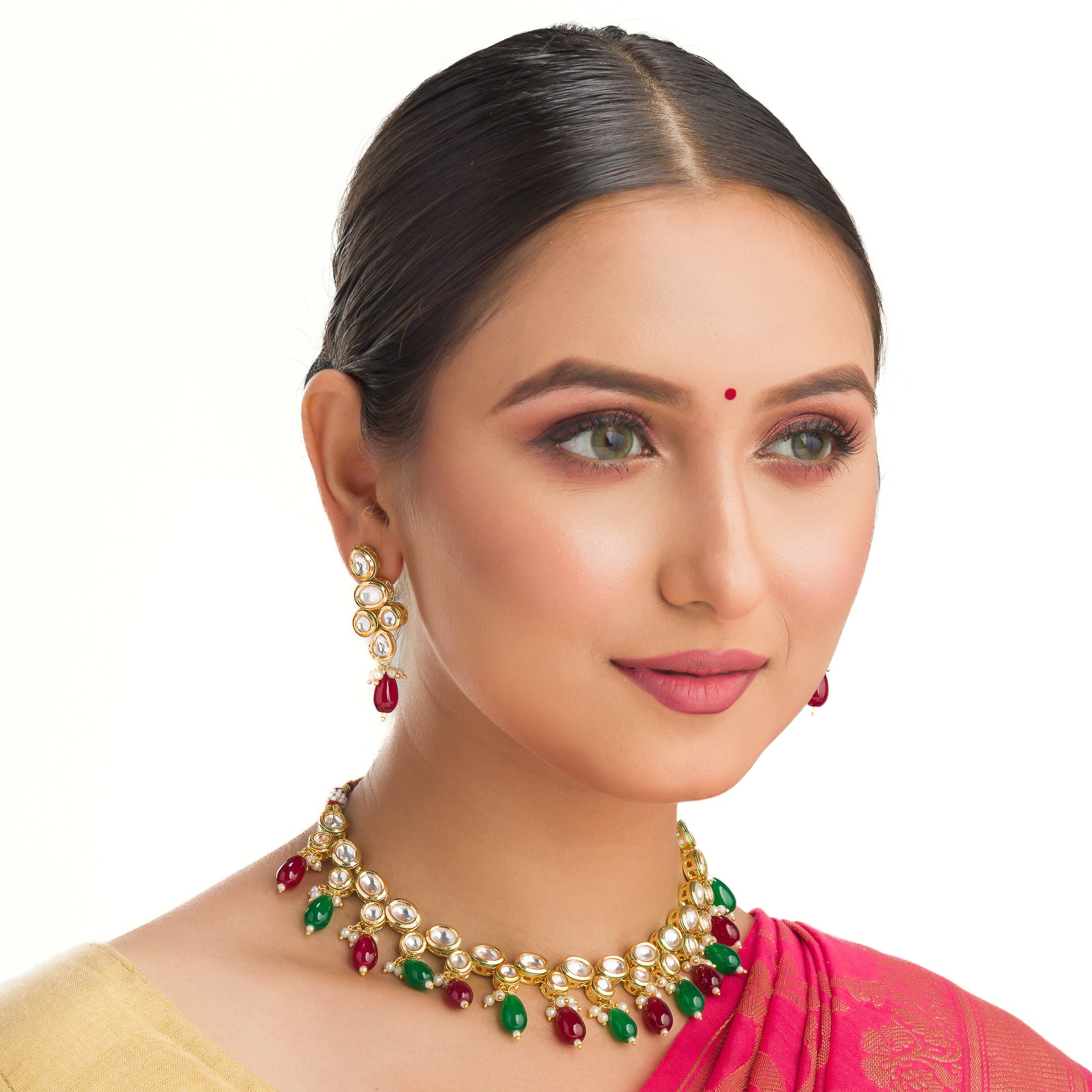 Elegant multicolor Kundan necklace with green and maroon stones for a regal, sophisticated party look.
