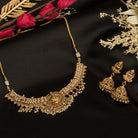 Graceful temple necklace with white pearls adds a touch of classic festival sophistication.
