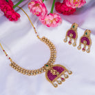 Elegant pink gold-tone short necklace exudes understated charm for a graceful festival look.
