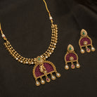 Elegant pink gold-tone short necklace exudes understated charm for a graceful festival look.
