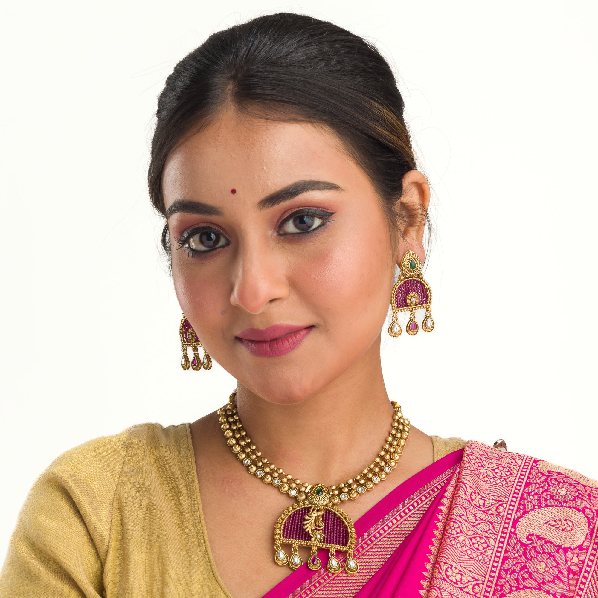Elegant pink gold-tone short necklace exudes understated charm for a graceful festival look.
