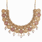 Intricate coin-style temple necklace highlights classic craftsmanship and timeless tradition.
