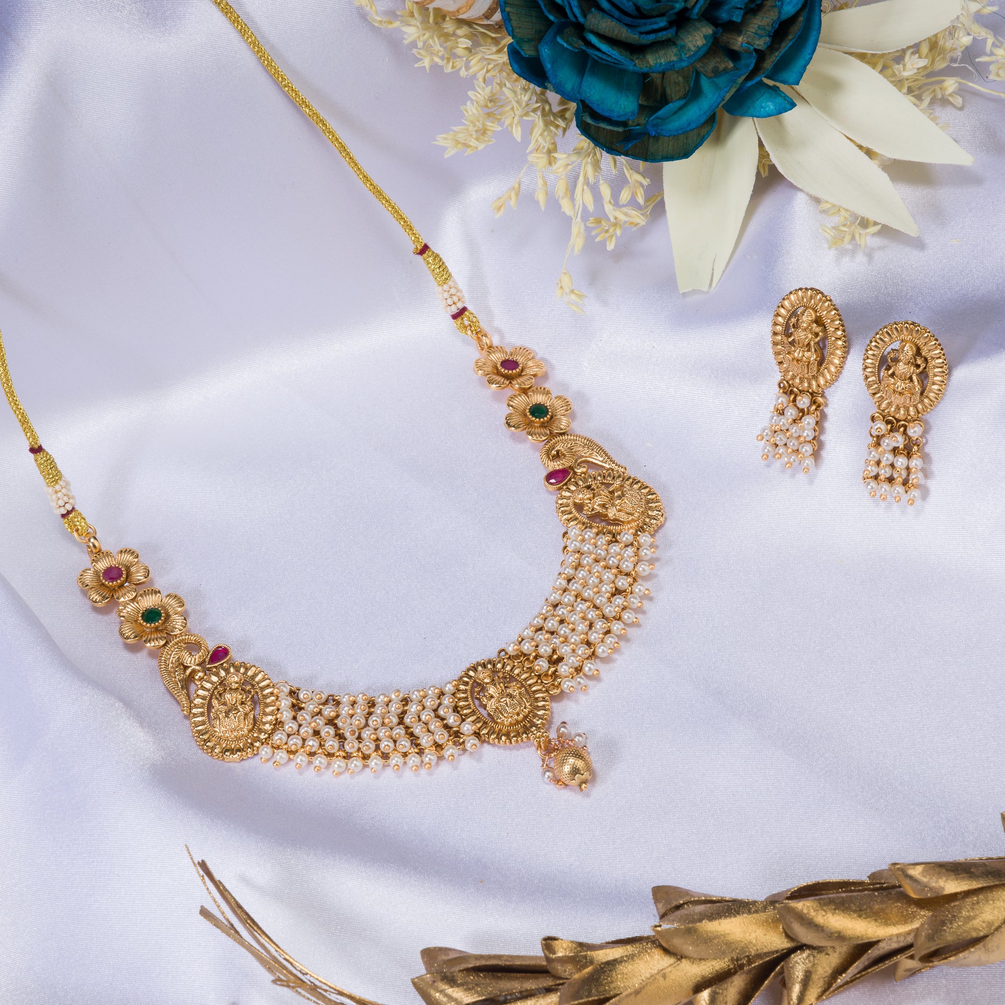 Temple necklace with intricate craftsmanship adds timeless elegance to your festive ensemble.
