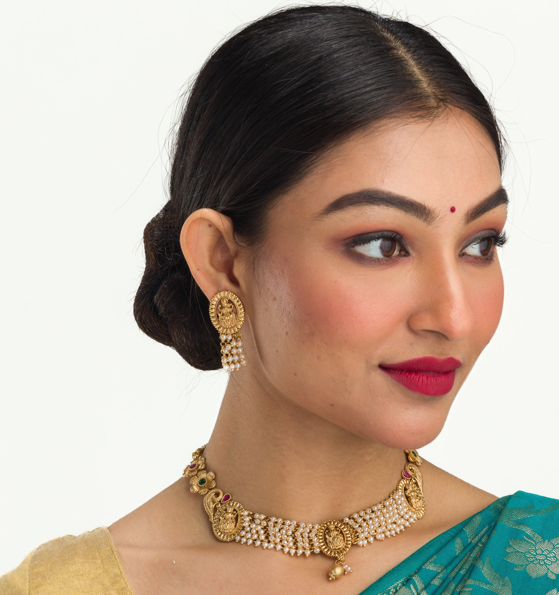 Temple necklace with intricate craftsmanship adds timeless elegance to your festive ensemble.
