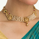 Temple necklace with intricate craftsmanship adds timeless elegance to your festive ensemble.

