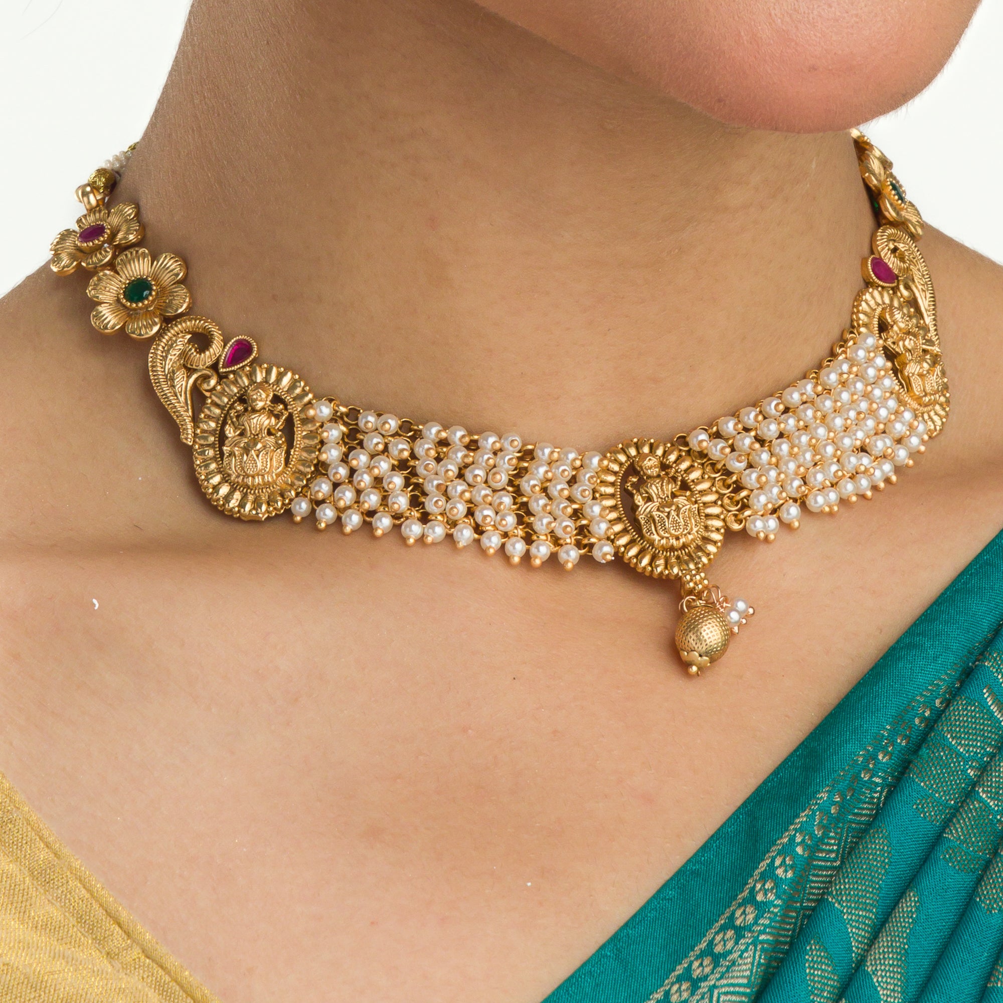 Temple necklace with intricate craftsmanship adds timeless elegance to your festive ensemble.
