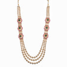 Kundan choker with maroon and green stones offers a regal and vibrant festival look.

