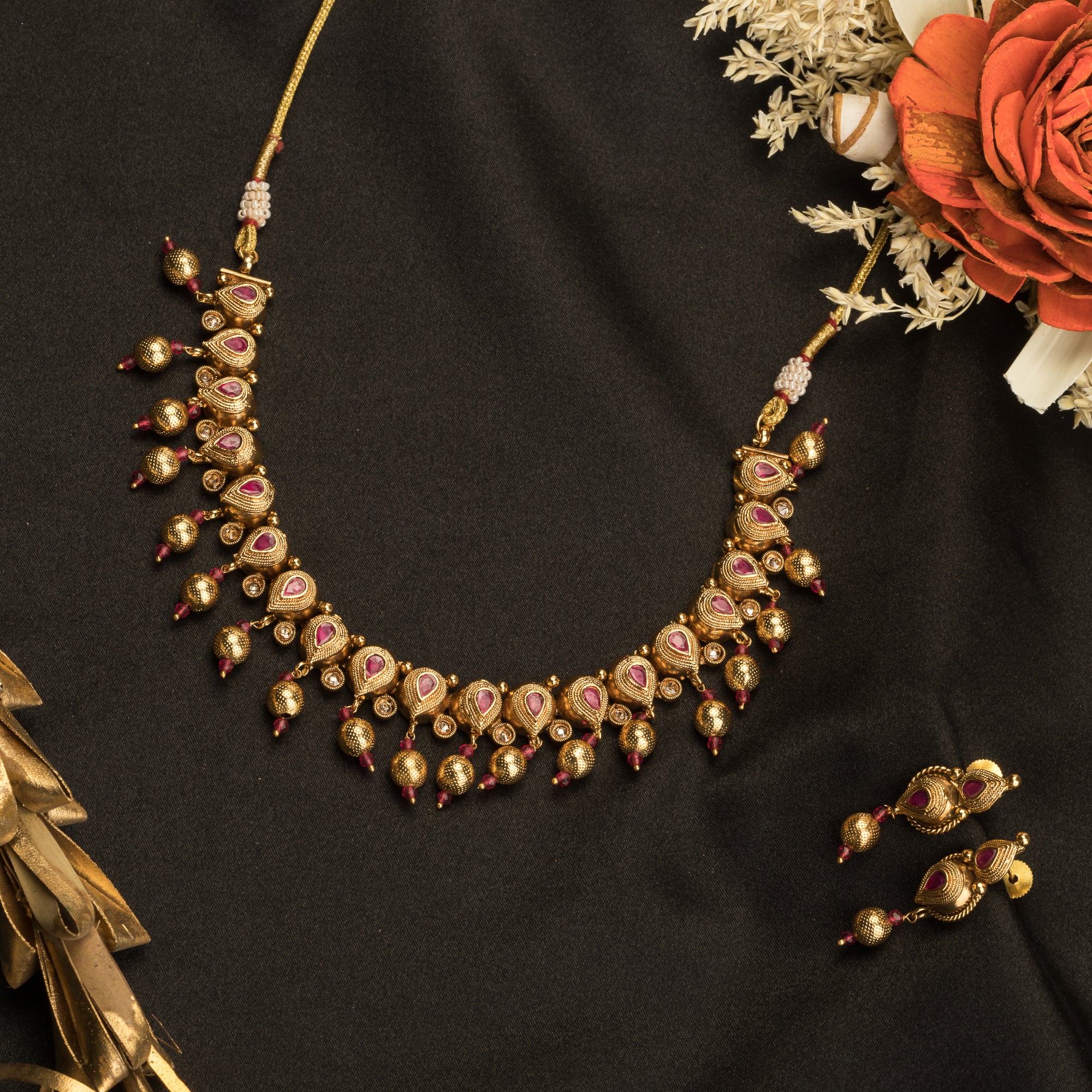 Sophisticated gold-tone choker exudes timeless charm for festive occasions
