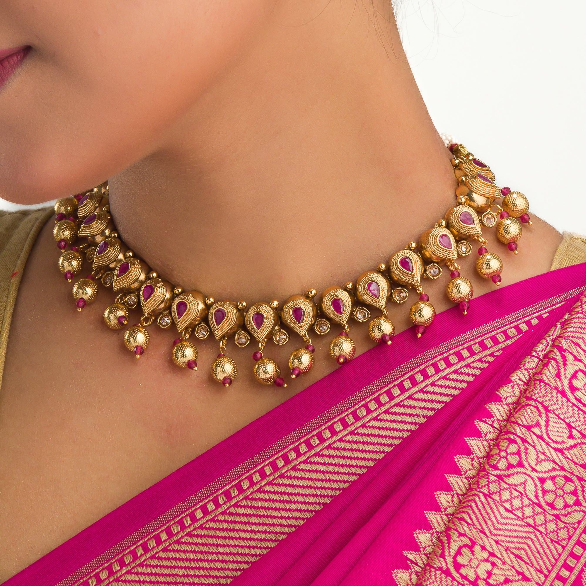 Sophisticated gold-tone choker exudes timeless charm for festive occasions
