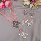 A short necklace with vibrant multi-colour stones brings playful flair to festive attire.
