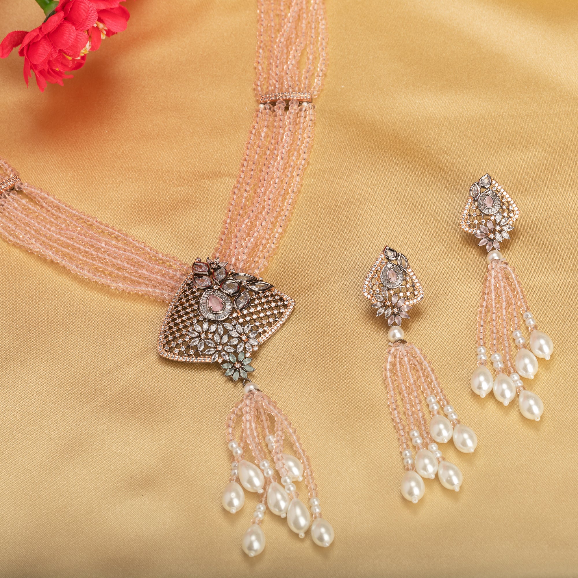A short necklace with vibrant multi-colour stones brings playful flair to festive attire.
