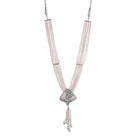 A short necklace with vibrant multi-colour stones brings playful flair to festive attire.
