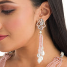 A short necklace with vibrant multi-colour stones brings playful flair to festive attire.
