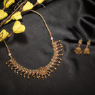 Gold long necklace with multi-color stones exudes vibrant elegance for a festive celebration.
