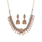 Gold long necklace with multi-color stones exudes vibrant elegance for a festive celebration.

