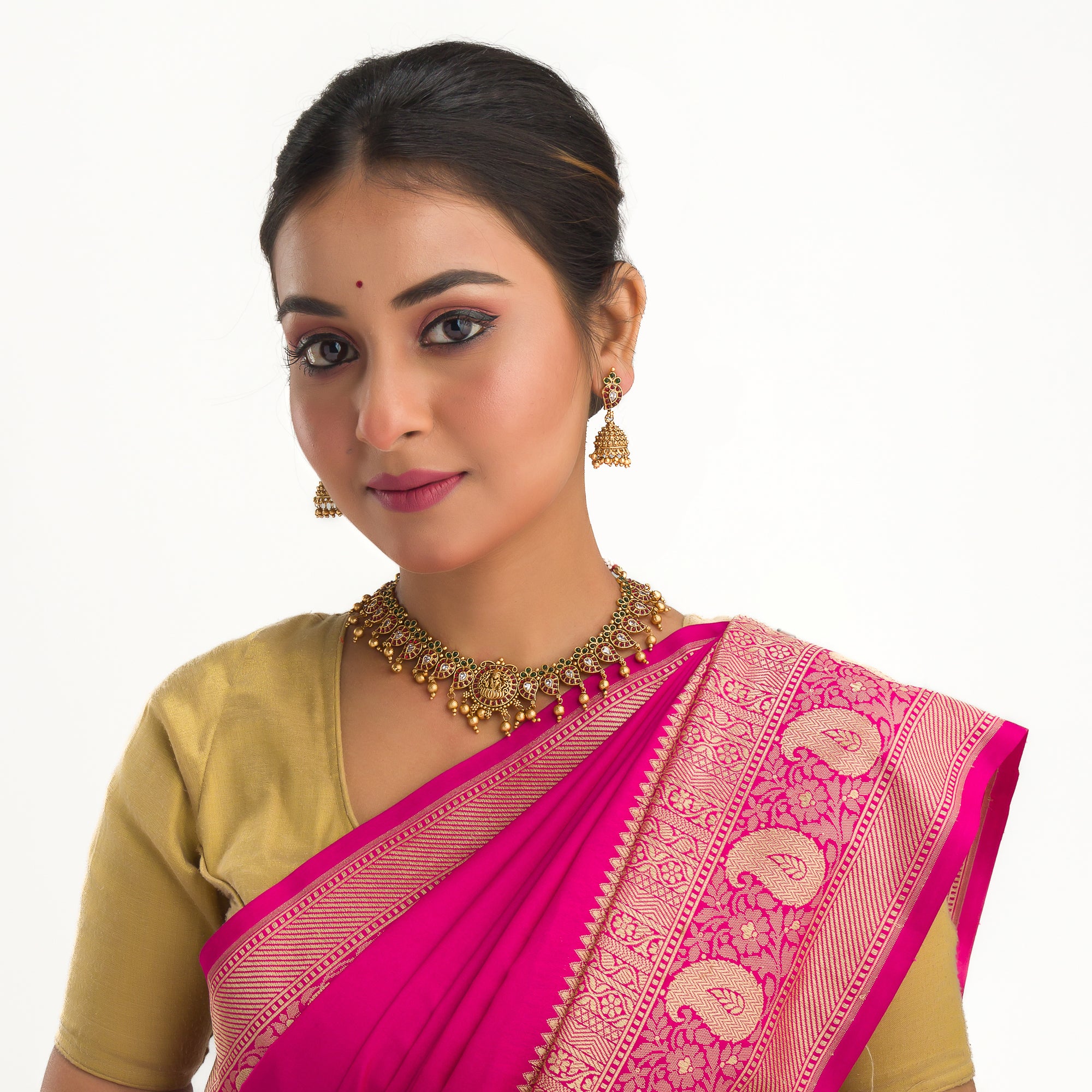 Gold long necklace with multi-color stones exudes vibrant elegance for a festive celebration.
