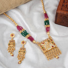 Vibrant gold long necklace with multicolor stones enhances festive attire with vibrant elegance
