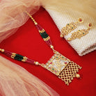 Vibrant gold long necklace with multicolor stones enhances festive attire with vibrant elegance
