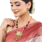 Vibrant gold long necklace with multicolor stones enhances festive attire with vibrant elegance
