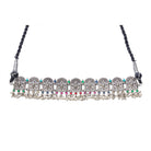 "Oxidized peacock choker with white pearls and colorful stones radiates vintage charm."

