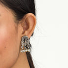 "Oxidized peacock choker with white pearls and colorful stones radiates vintage charm."
