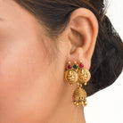 Coin-style gold-tone temple necklace exudes classic elegance and timeless tradition.
