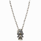 An oxidized dual-colour necklace with elephant and white pearls adds vintage charm and elegance.
