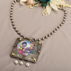 "Oxidized long necklace with Radha Krishna image brings spiritual charm."

