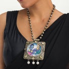 "Oxidized long necklace with Radha Krishna image brings spiritual charm."
