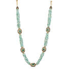 "Gold-tone long necklace with green sea stone offers a refreshing, natural touch."
