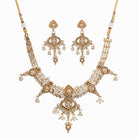 "Gold-tone necklace set with white pearls for a classic and elegant look."
