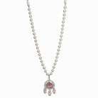"Graceful pink pendant on a white pearl long necklace for a feminine touch."
