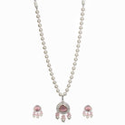 "Graceful pink pendant on a white pearl long necklace for a feminine touch."
