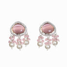 "Graceful pink pendant on a white pearl long necklace for a feminine touch."
