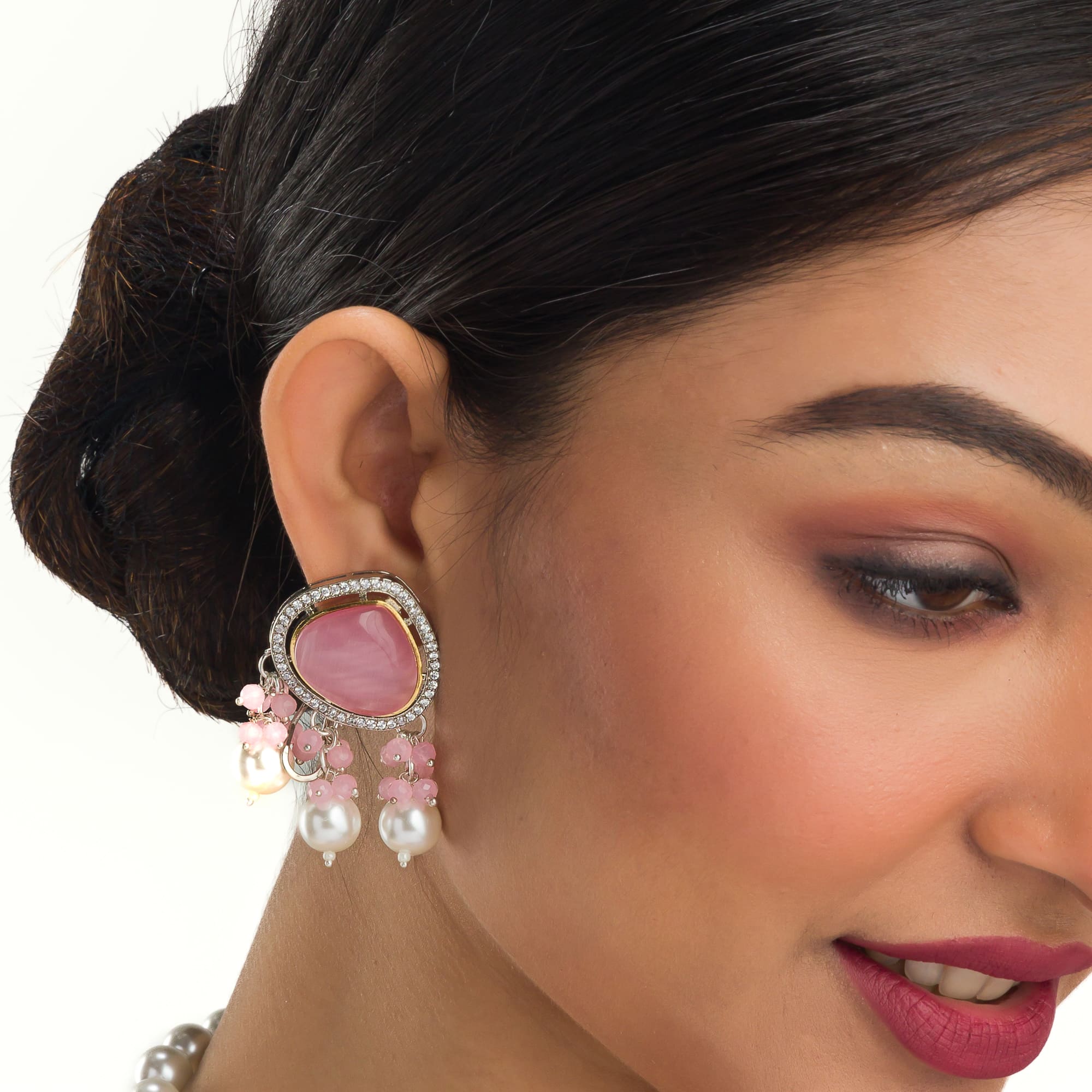 "Graceful pink pendant on a white pearl long necklace for a feminine touch."
