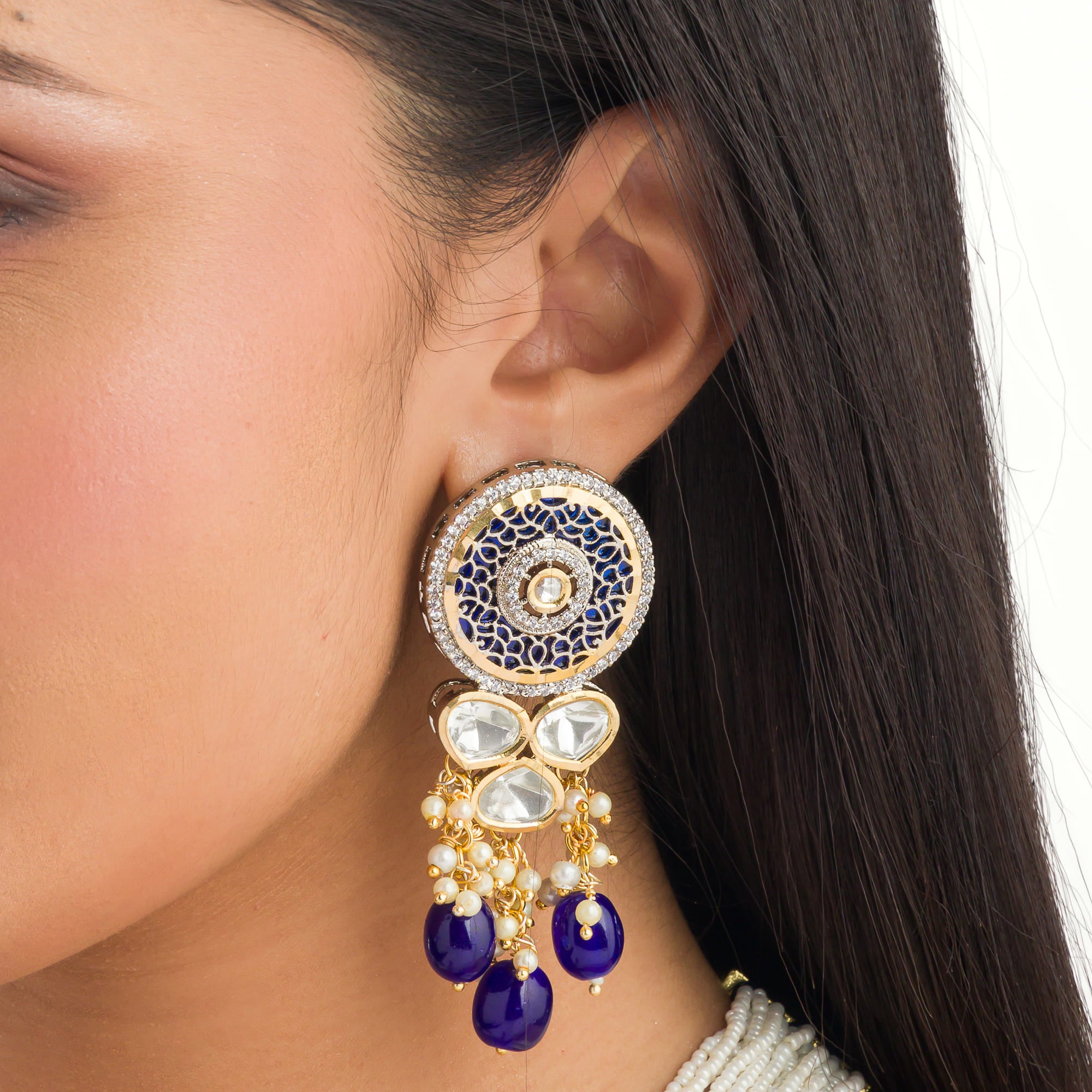 "Maharani long necklace with blue Kundan and white pearls for royal sophistication."
