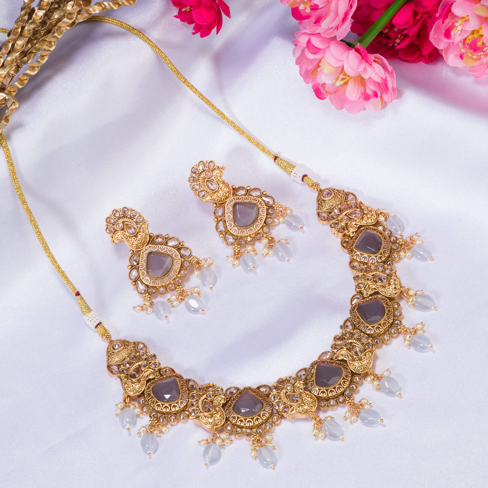 "Gold-tone necklace with grey stones and Kundan for a chic, modern appeal."
