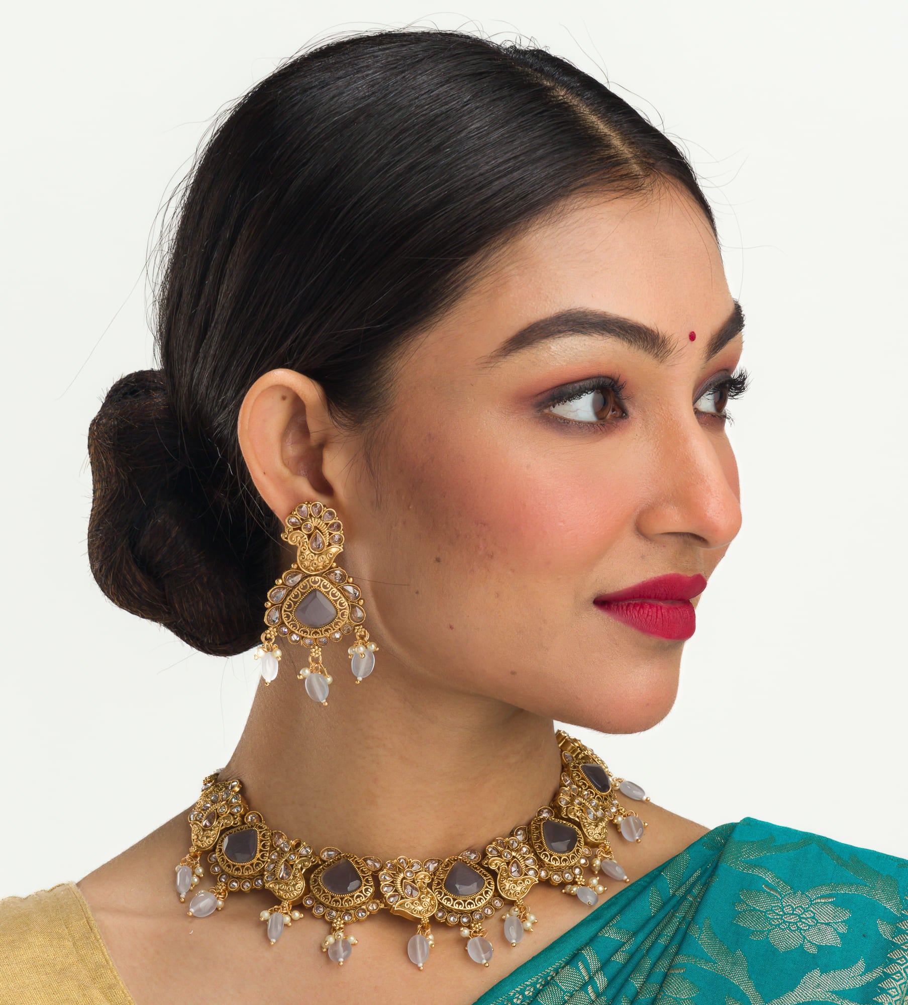 "Gold-tone necklace with grey stones and Kundan for a chic, modern appeal."
