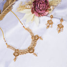 "Elegant goldtone necklace with lustrous pearls for timeless sophistication."
