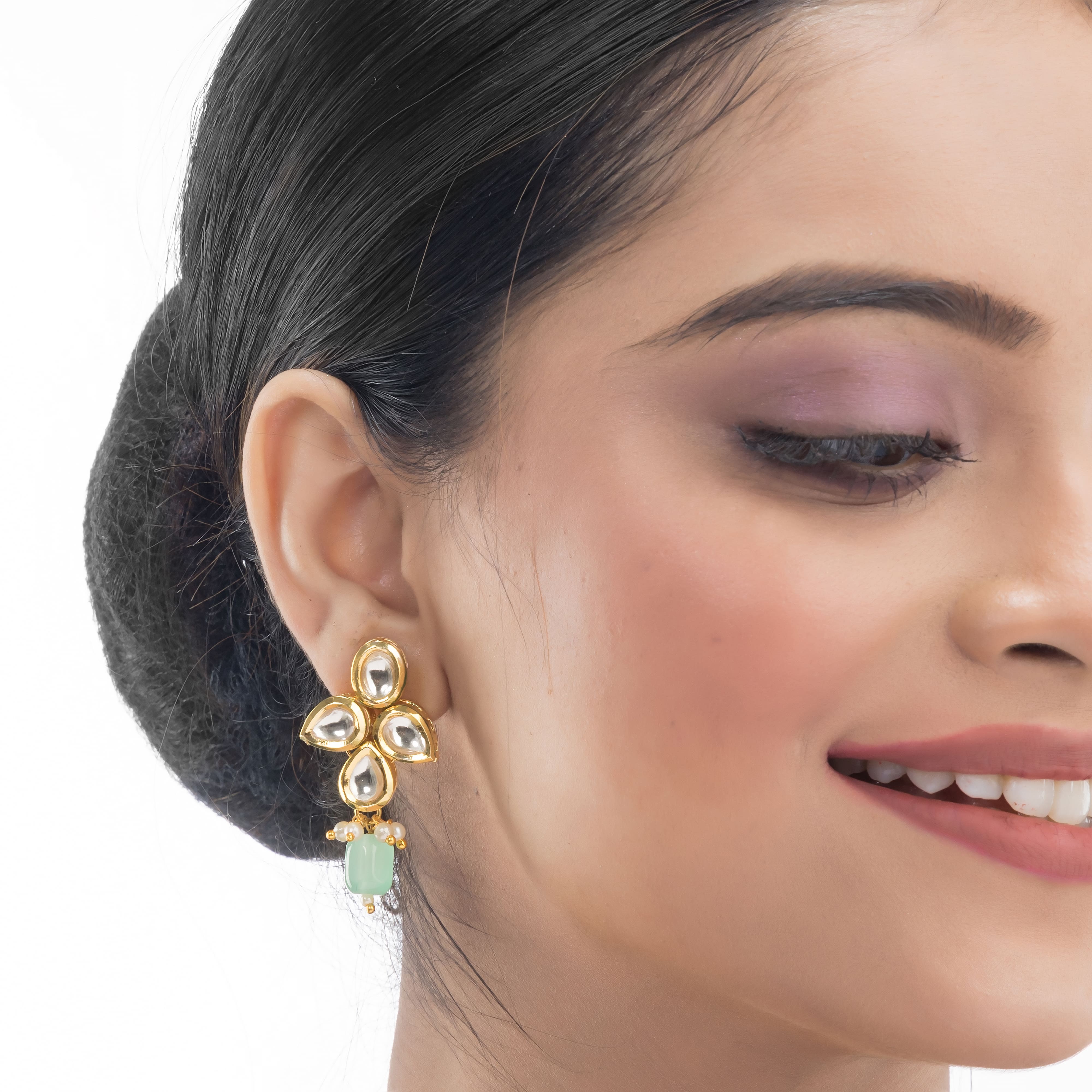 "Light green kundan necklace radiates vibrant, elegant charm."
