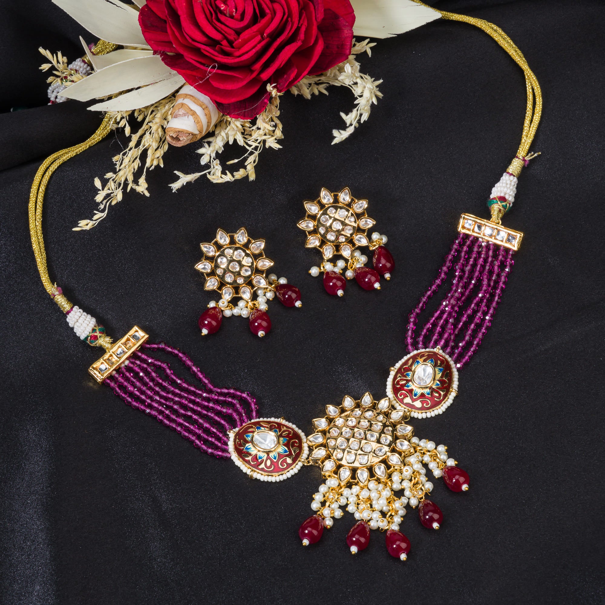 Pink kundan choker with gold-tone polish for a vibrant, elegant style.
