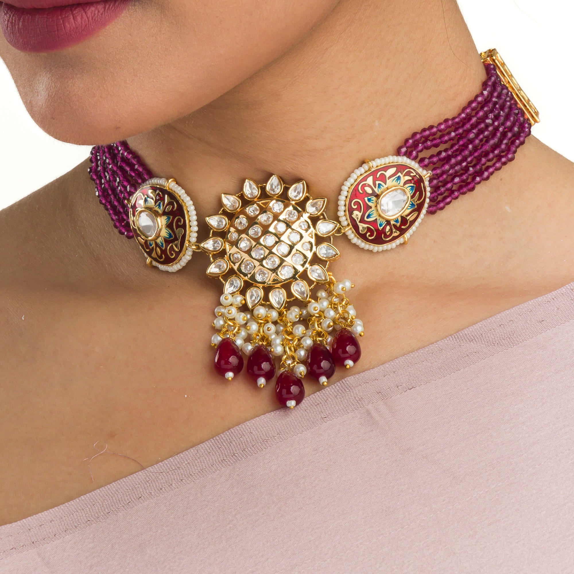 Pink kundan choker with gold-tone polish for a vibrant, elegant style.
