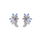 "Zircon flower-shaped earrings with a blue zircon center add vibrant sparkle."
