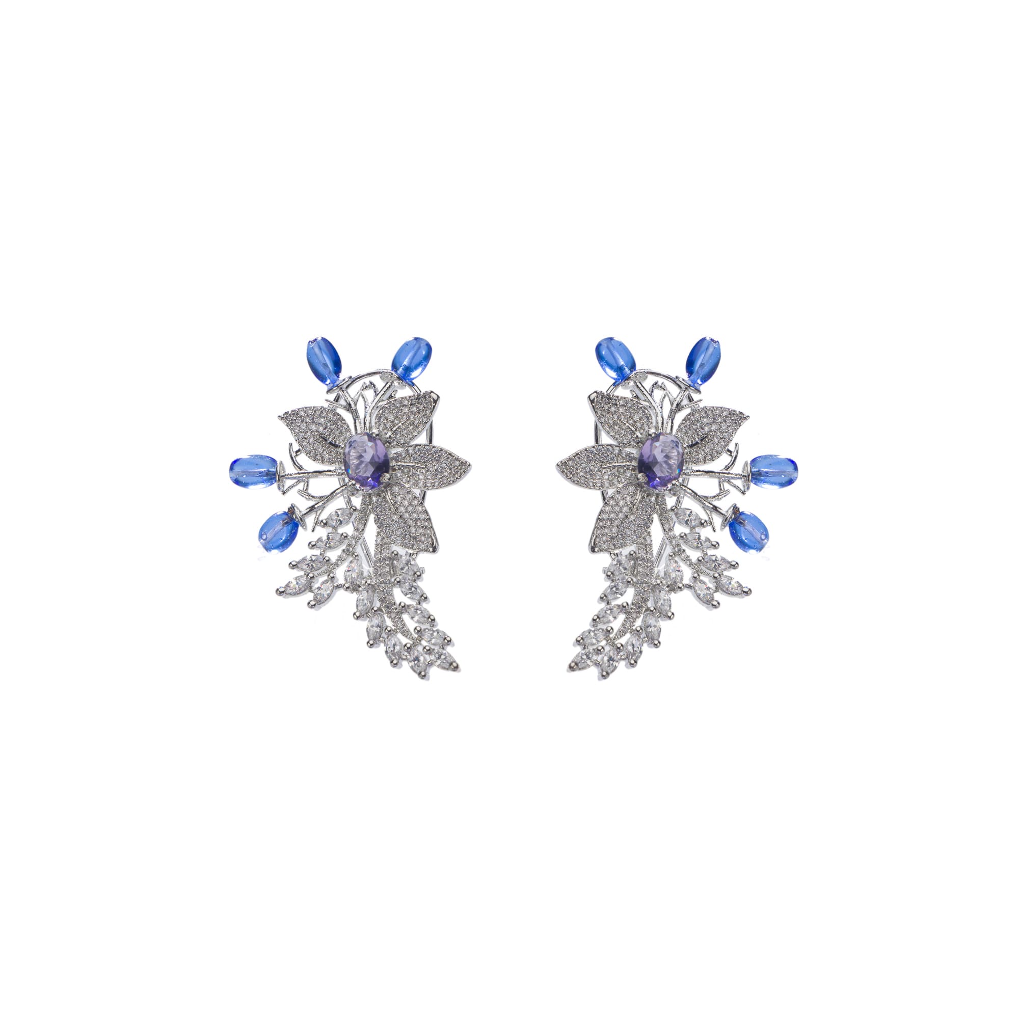 "Zircon flower-shaped earrings with a blue zircon center add vibrant sparkle."
