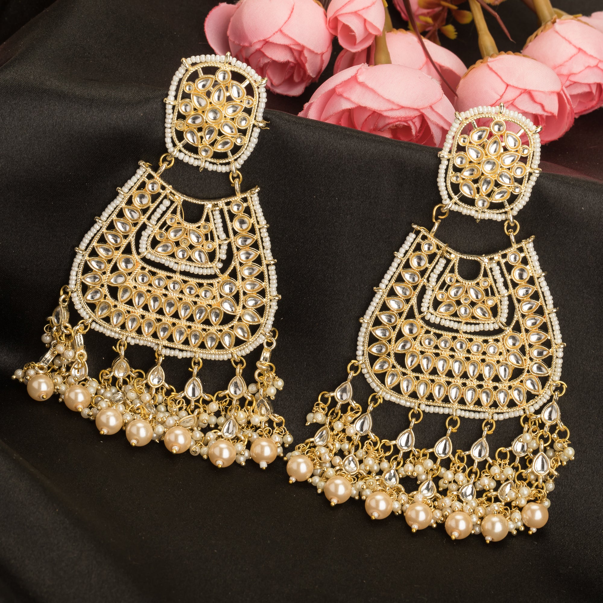 "Wheat-colored Kundan earrings make a bold, elegant statement."
