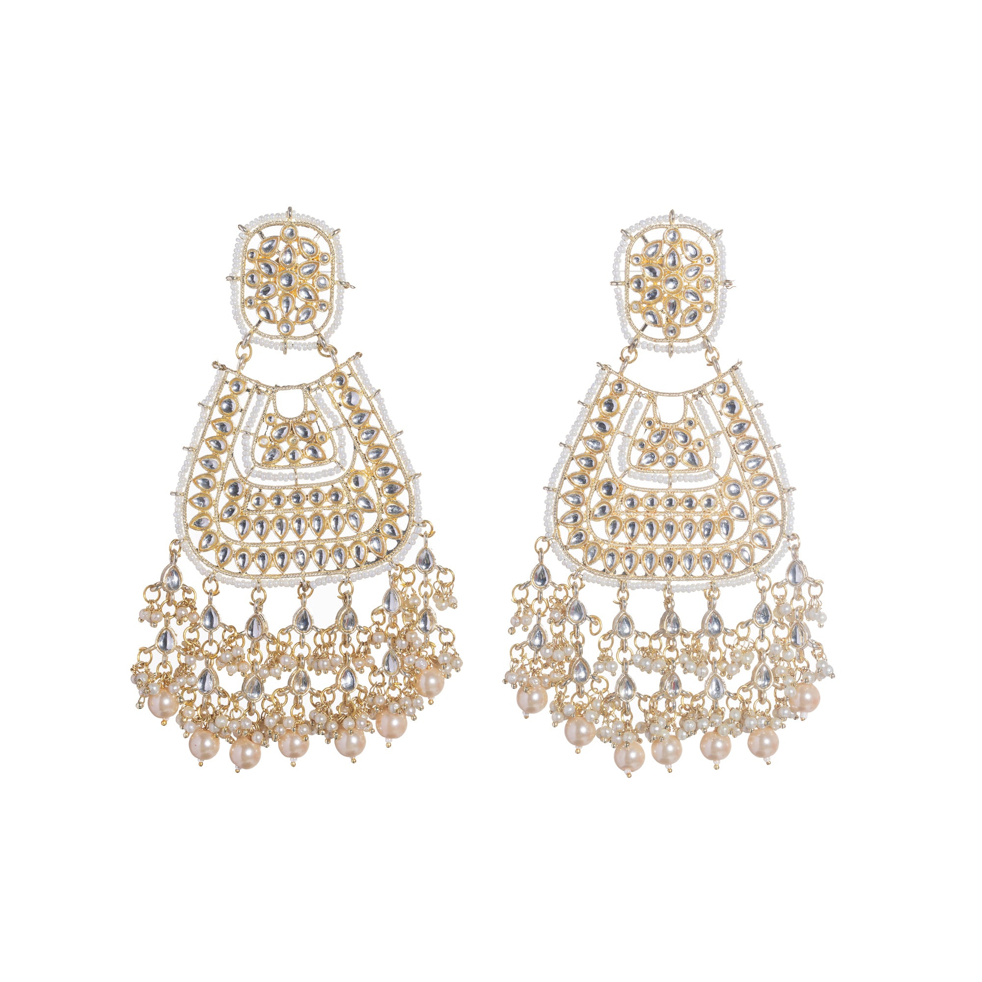 "Wheat-colored Kundan earrings make a bold, elegant statement."
