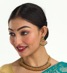 "Gold-tone necklace with multi-color stones adds vibrant style and festive charm."
